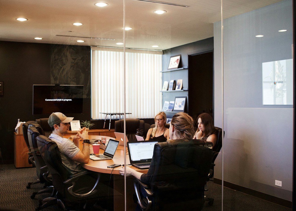 Leaders working together in a bright conference room