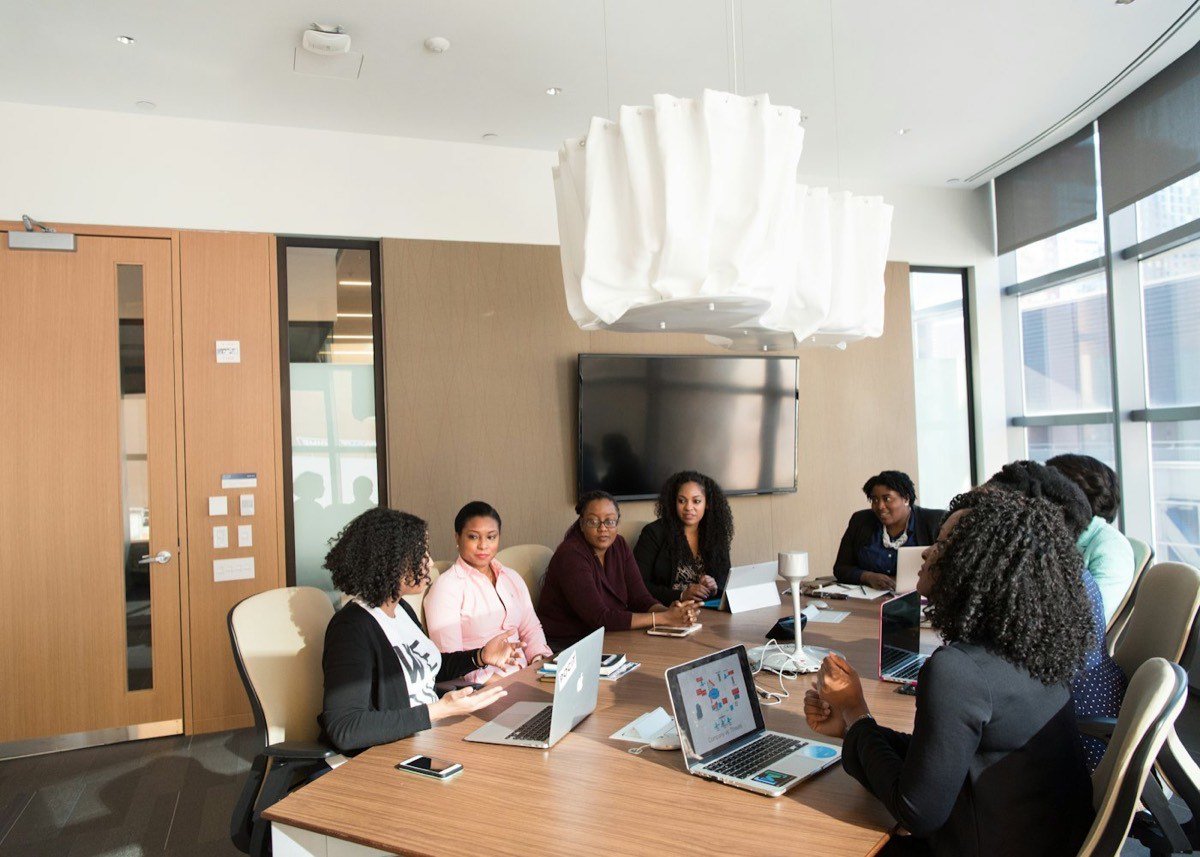 A leader working through a problem with team members